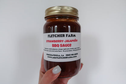 8oz jar of local Mrs. Fletcher Farms Strawberry Jalape√±o BBQ Sauce from Fletcher Farms. This spicy-sweet BBQ sauce is made with local Ponchatoula strawberries and fresh jalape√±os.